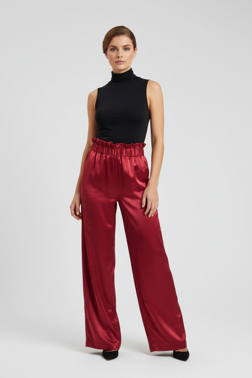 This photo shows a pair of red, satin pants that offer a size adjustable waistband that fits multiple sizes.