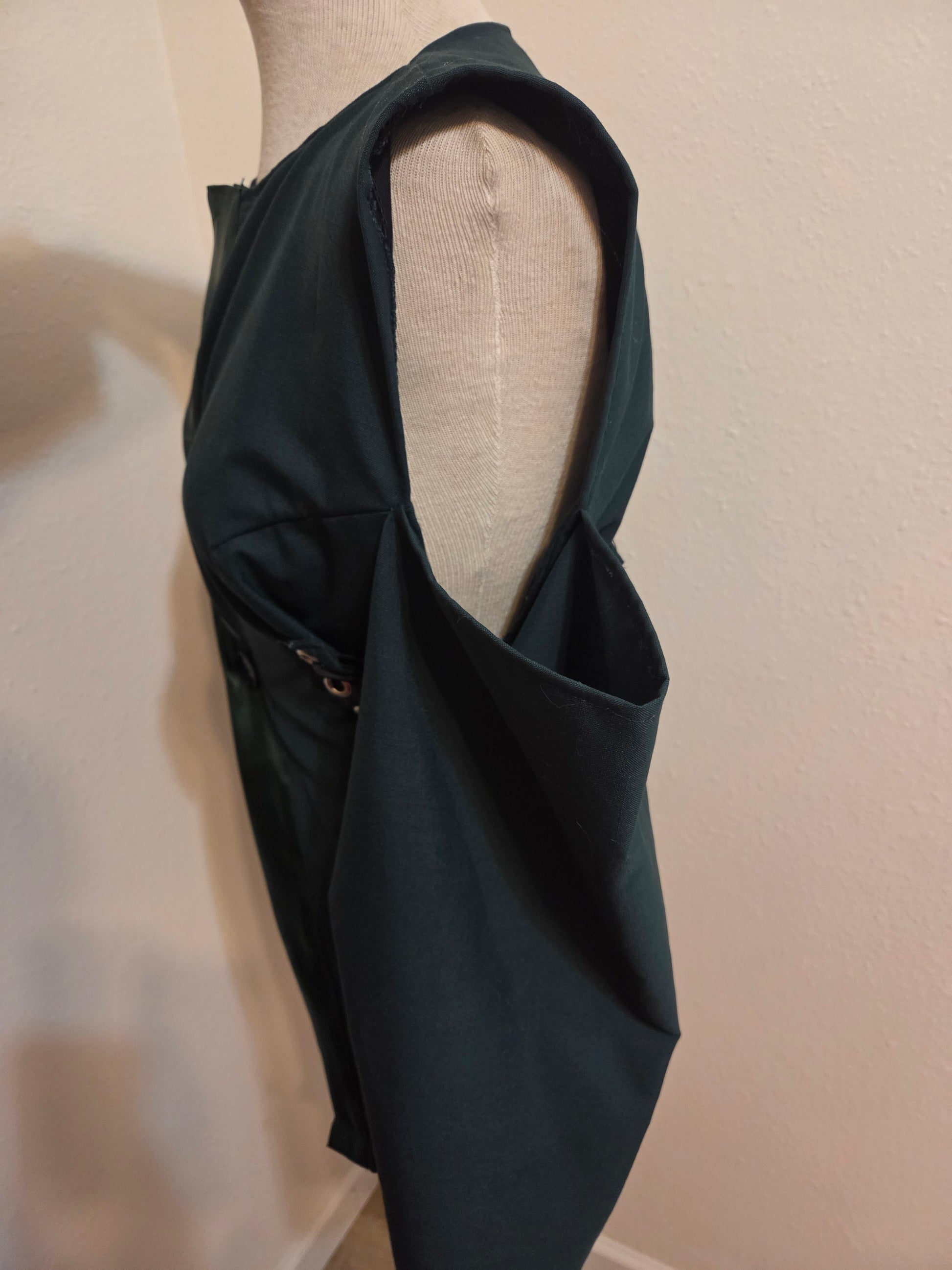 This photo shows the side view of a size adjustable blazer and the open shoulder concept. 