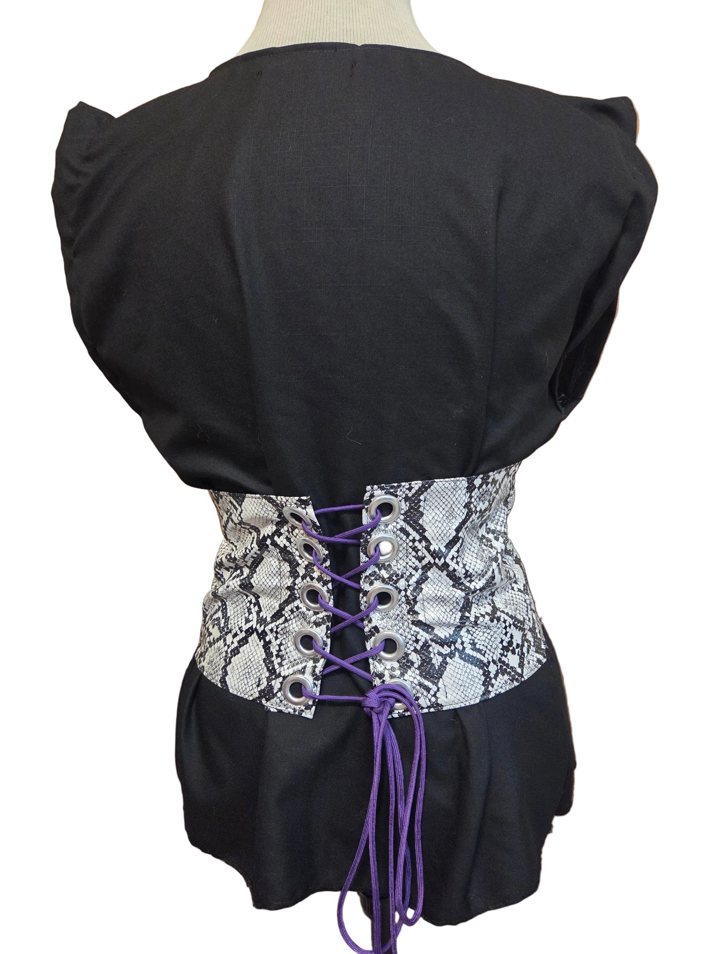 This photo shows a size adjustable black linen top with a faux snake skin corset on top.