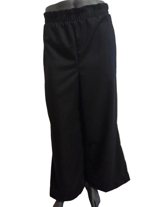 This photo shows a black pair of size adjustable black palazzo pants from the front