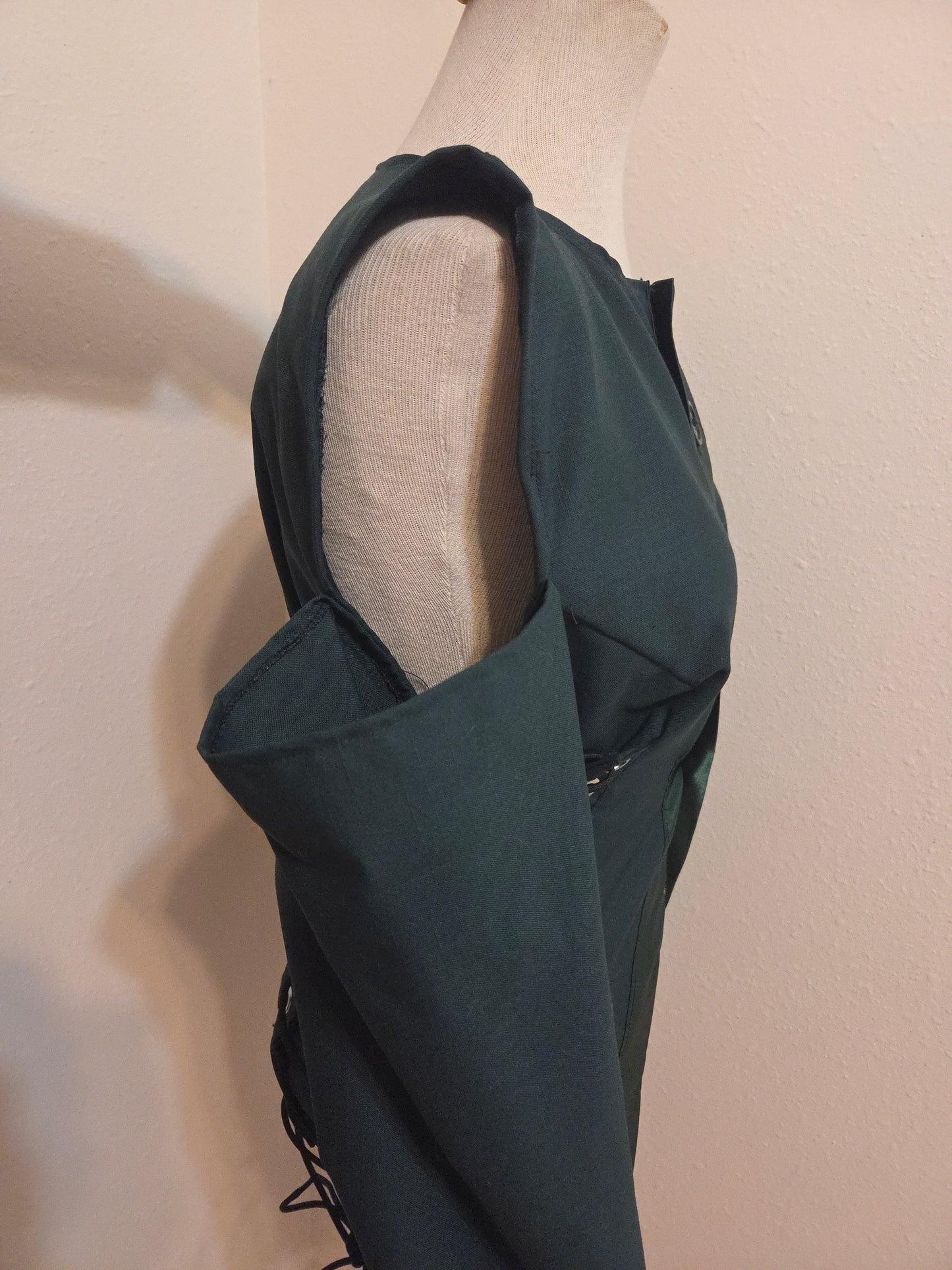 Size Adjustable jacket on a mannequin showing the open shoulder concept. 