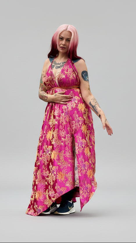 This photo shows a model wearing a size adjustable pink silk kimono style gown