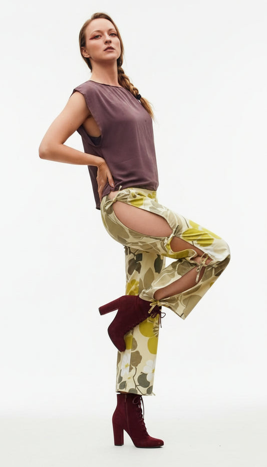 This photo shows a model wearing the size adjustable open thigh tie pants paired with the brown mousse top