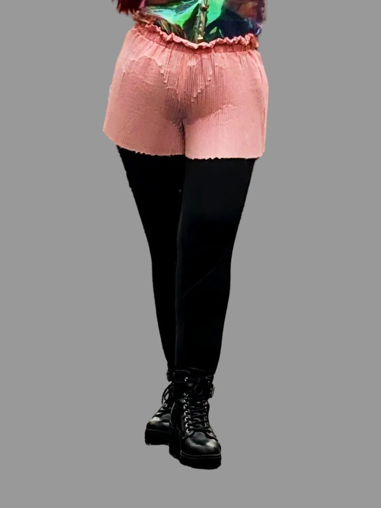 This photo shows a pair of bubblegum pink, pleated shorts with a size- adjustable waistband. 