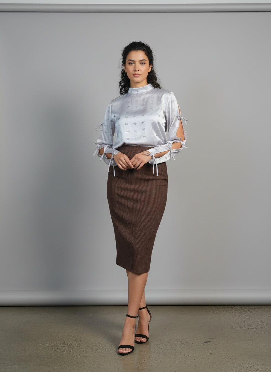 This photo shows a model size 8 wearing a brown satin size adjustable pencil skirt paired with the pink tie top