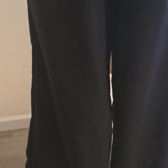 This video shows a back and side view of our black size adjustable palazzo pants