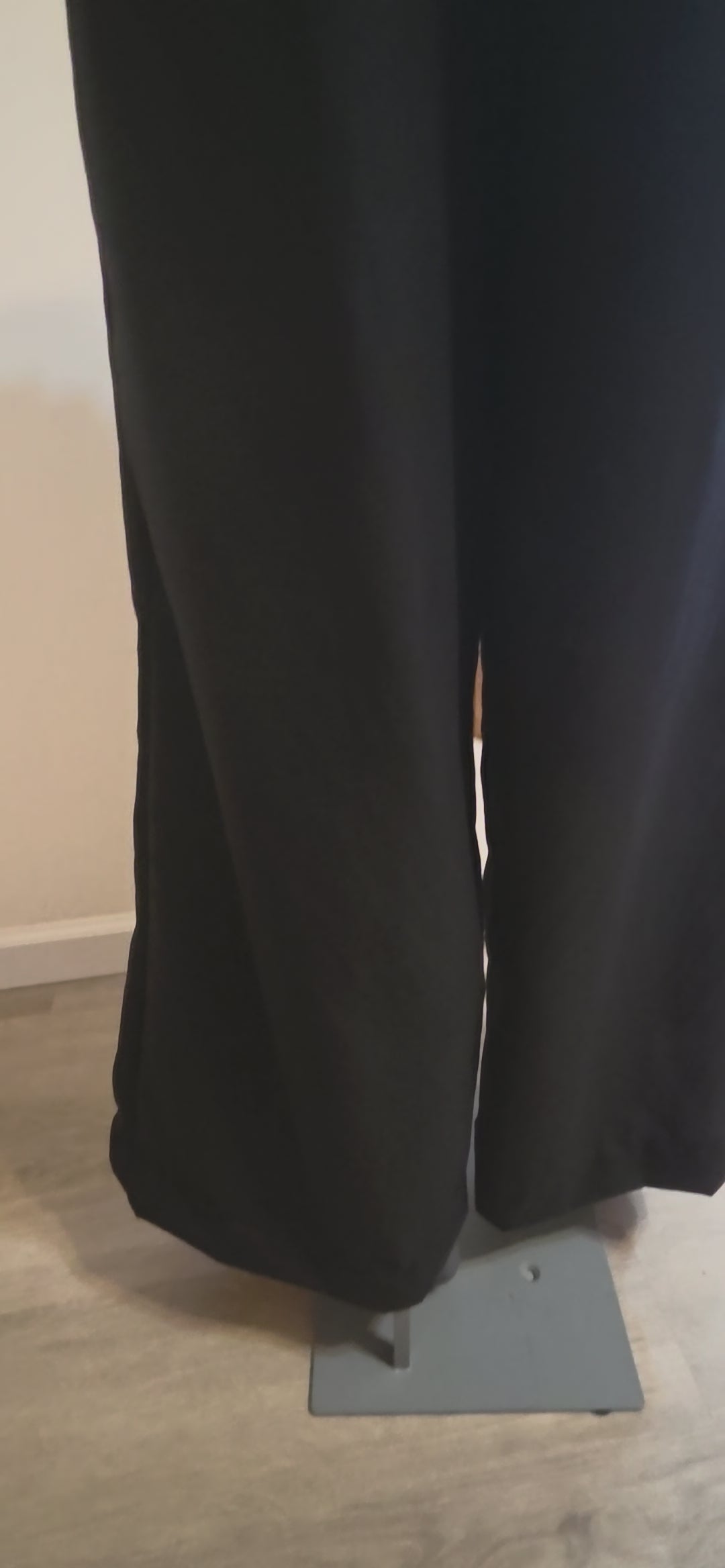 This video shows a back and side view of our black size adjustable palazzo pants